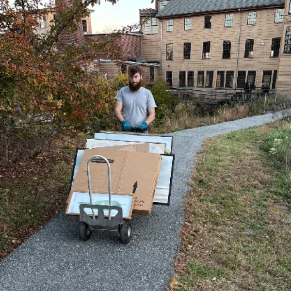 Image showing movers carrying furniture during relocation.